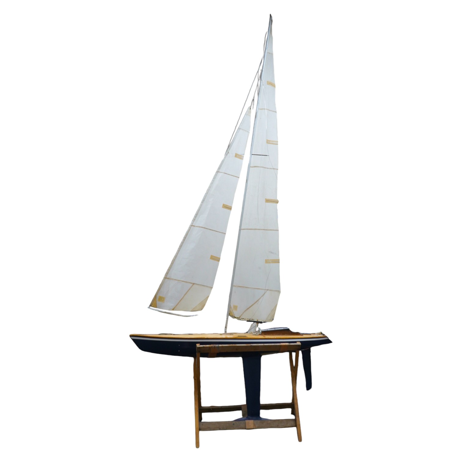 A large pond yacht, of wooden construction with some detailing to the deck, approx 250cm high, hull 120cm. Condition - fair to good.